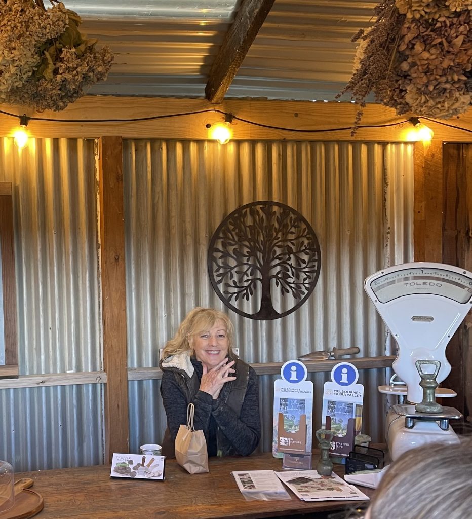 female truffle farmer ready to serve customers in rustic truffle shop.